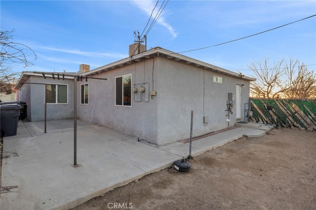 rear view of property featuring a patio