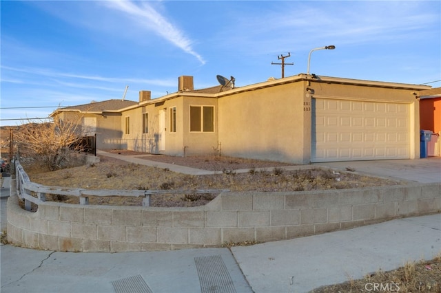 ranch-style home featuring a garage