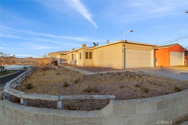 ranch-style home featuring a garage