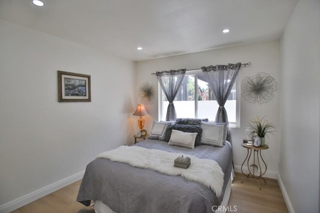 bedroom with light wood-type flooring