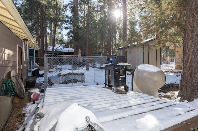 snowy yard with an outdoor structure