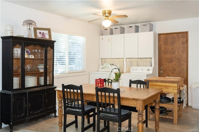 dining space featuring washer / dryer, ceiling fan, and light hardwood / wood-style flooring