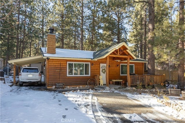 view of front of property featuring a carport