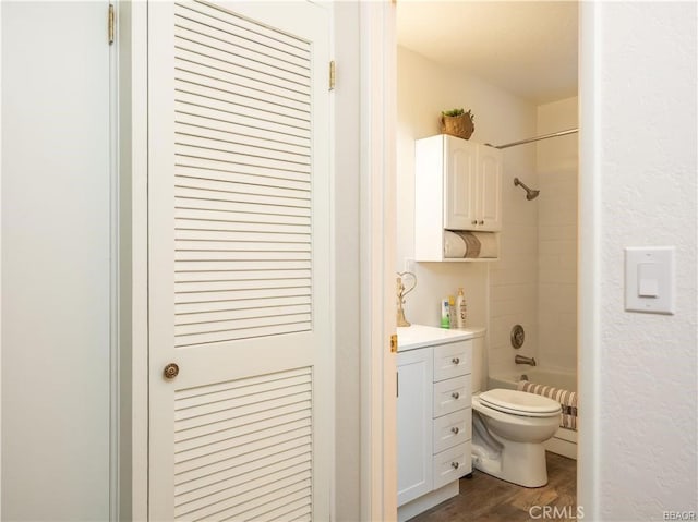 full bathroom featuring toilet, shower / bath combination, vanity, and hardwood / wood-style floors