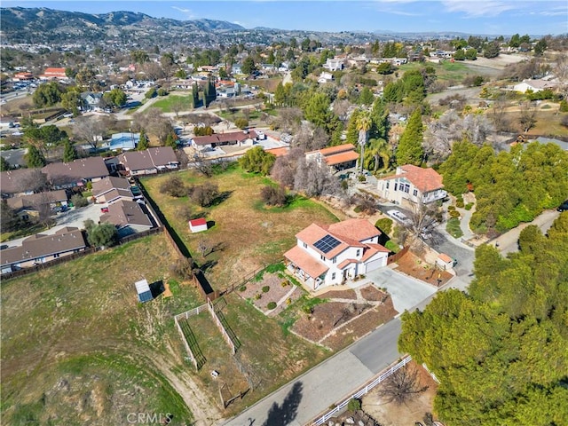 drone / aerial view with a mountain view and a residential view