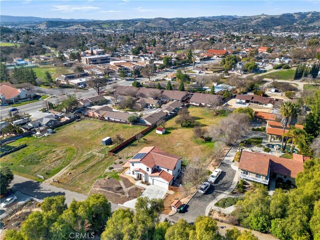 drone / aerial view featuring a mountain view and a residential view