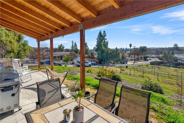 view of patio with fence and outdoor dining area