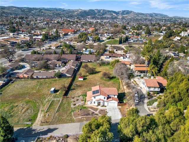 birds eye view of property with a residential view and a mountain view