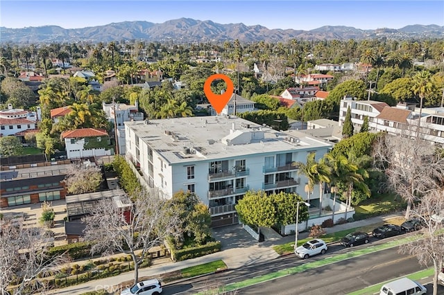 birds eye view of property with a mountain view