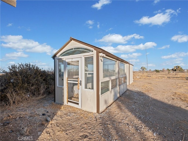 view of outbuilding with a rural view