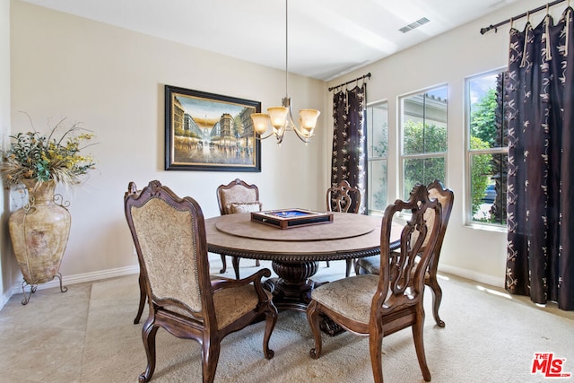 dining space with a notable chandelier