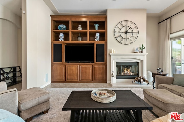 living room featuring light tile patterned flooring