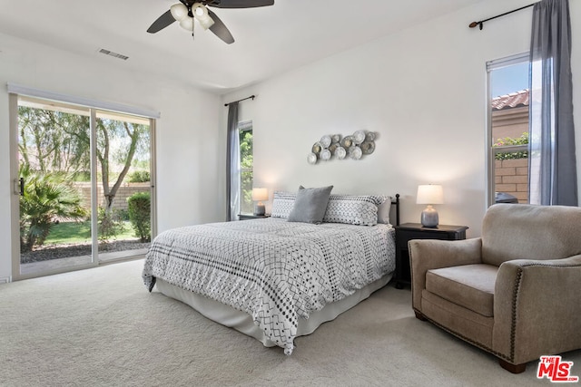 bedroom featuring ceiling fan, access to exterior, and carpet flooring