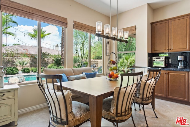 dining space with a notable chandelier