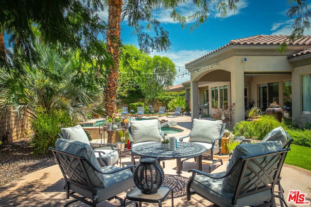 view of patio with a swimming pool