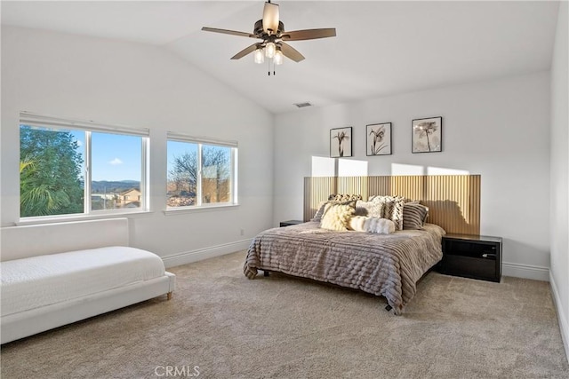 carpeted bedroom featuring ceiling fan and vaulted ceiling