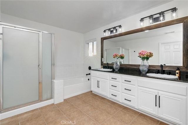 bathroom with plus walk in shower, tile patterned floors, and vanity