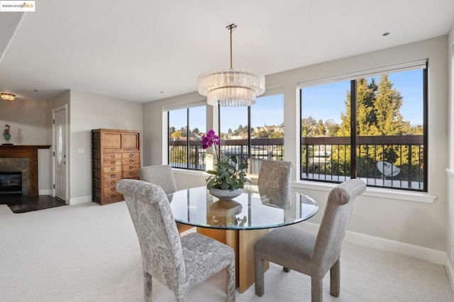 dining room with light carpet and a notable chandelier