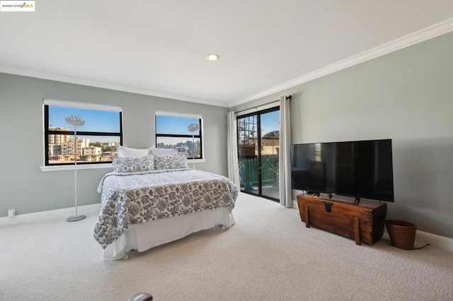 carpeted bedroom with access to exterior and crown molding