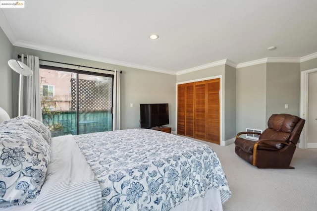 carpeted bedroom featuring a closet, access to exterior, and ornamental molding