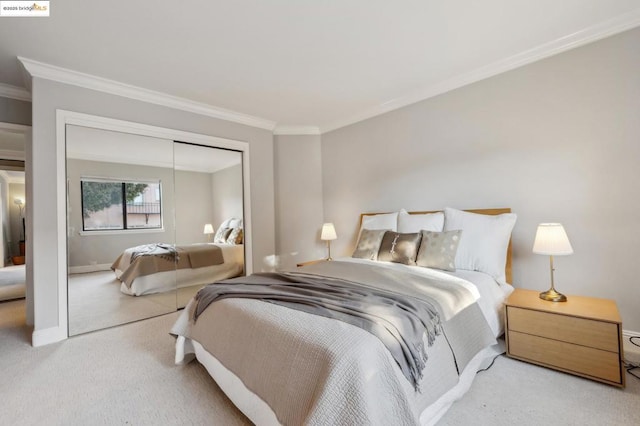 carpeted bedroom with a closet and ornamental molding