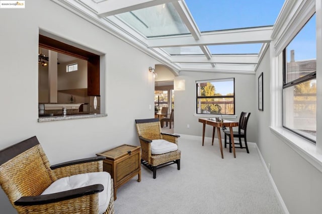 sunroom with lofted ceiling with skylight