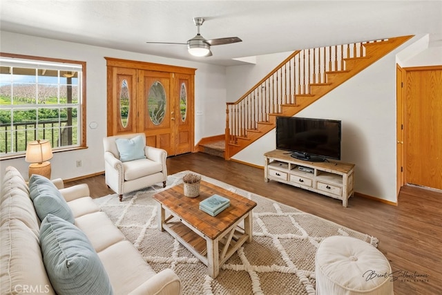 living room with hardwood / wood-style flooring and ceiling fan