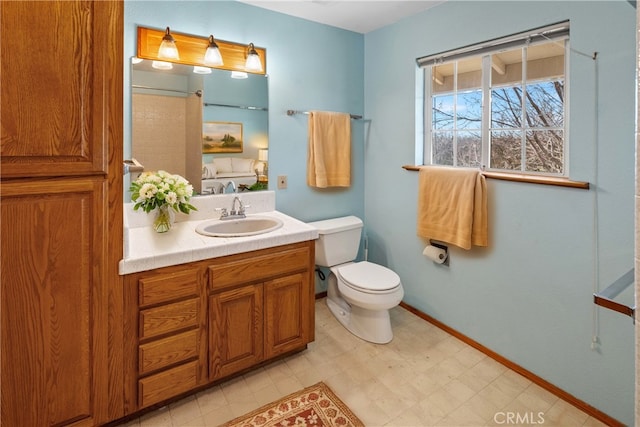 bathroom with toilet and vanity