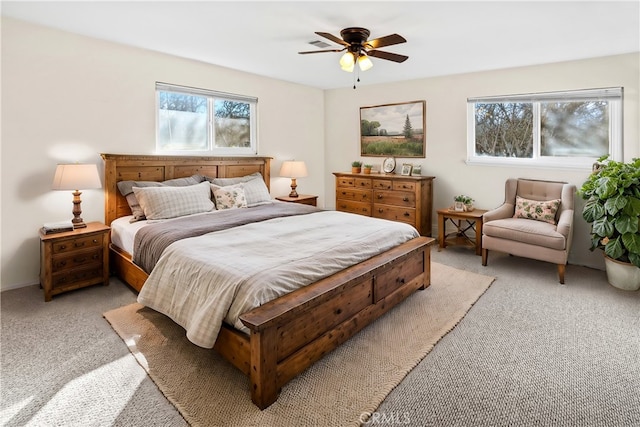 bedroom with light carpet and ceiling fan