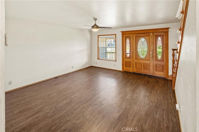 foyer featuring ceiling fan and dark hardwood / wood-style floors