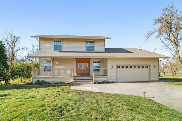 view of front of property featuring a garage, a front lawn, and a porch