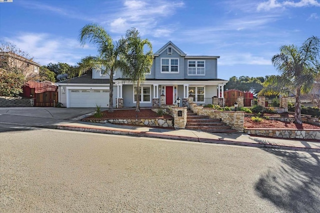 view of front of house with a garage and a porch