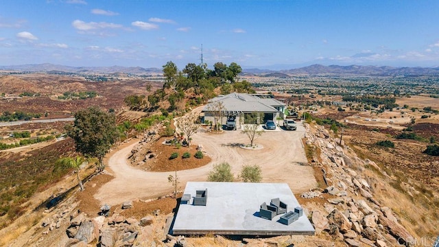 drone / aerial view featuring a mountain view