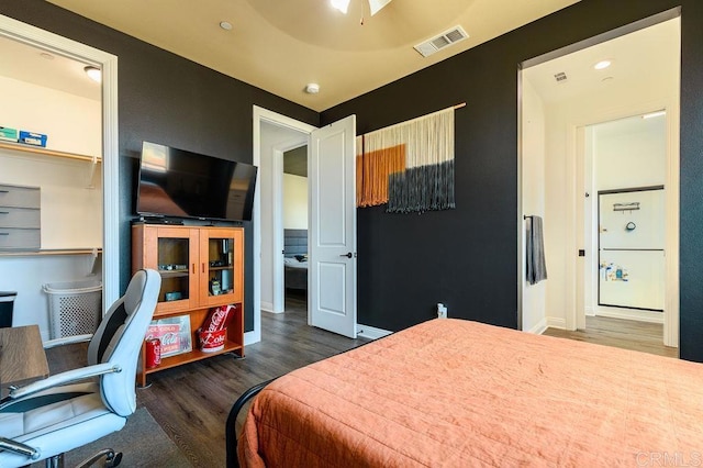 bedroom with ceiling fan and dark hardwood / wood-style floors