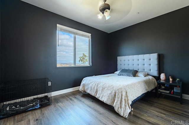 bedroom featuring ceiling fan and wood-type flooring