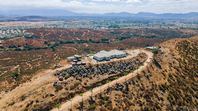 birds eye view of property with a mountain view