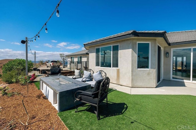 exterior space featuring a lawn and a patio