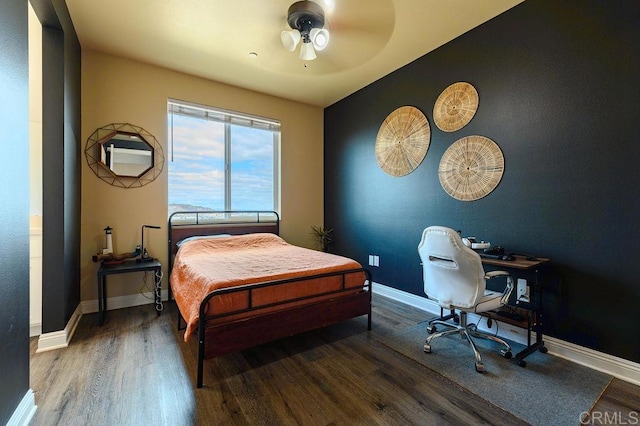 bedroom featuring ceiling fan and hardwood / wood-style floors