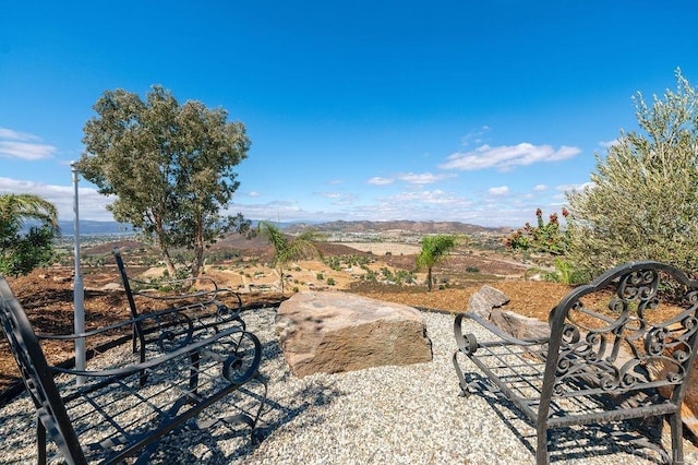 view of yard with a rural view