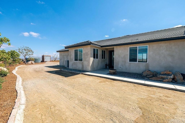 view of front of property with cooling unit