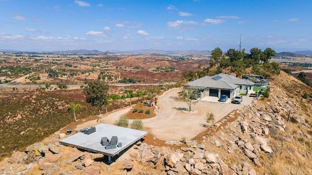 birds eye view of property featuring a mountain view