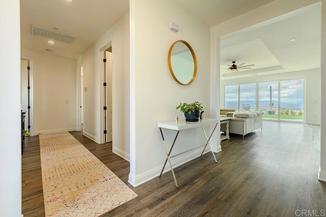 hallway with dark hardwood / wood-style flooring