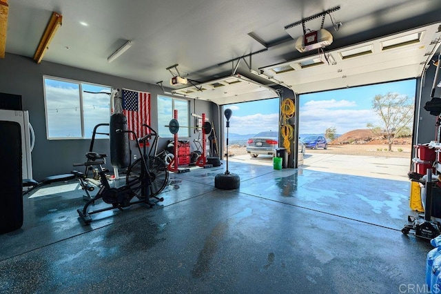 garage with a garage door opener and a mountain view