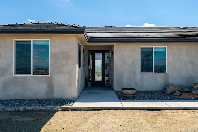 doorway to property with a patio