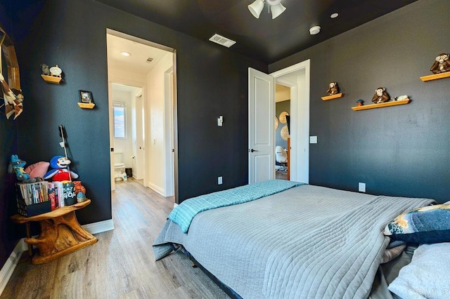 bedroom with ceiling fan and light hardwood / wood-style floors