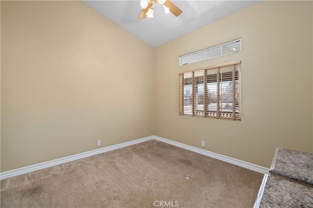 unfurnished room with ceiling fan, carpet flooring, and lofted ceiling