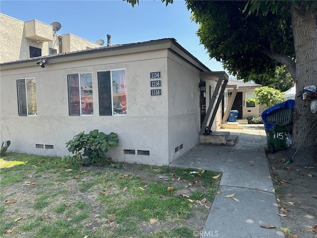 view of home's exterior with a patio area