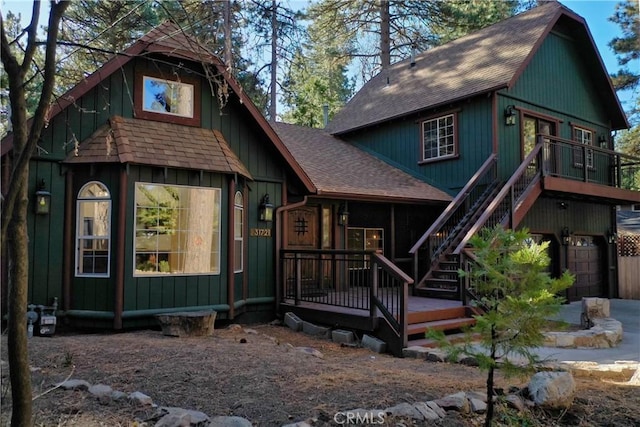 back of house featuring a wooden deck