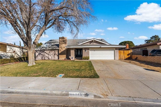 ranch-style house with a garage and a front lawn