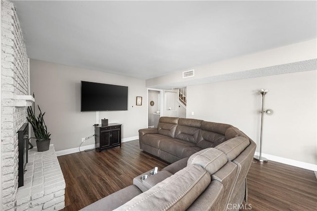 44028 Halcom Ave, Lancaster, CA 93536 - living room with dark wood-type flooring and a fireplace